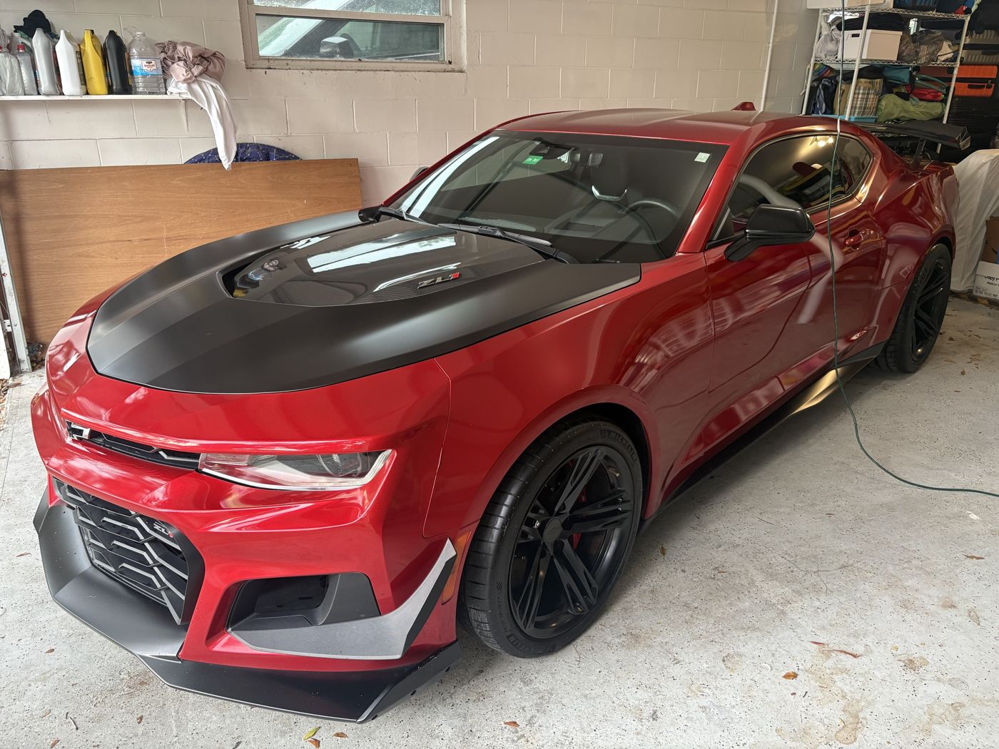 Red Camaro ZL1 with satin black hood after a detail